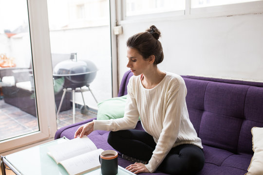 Young woman reading a book