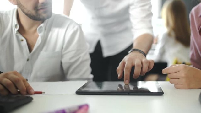 business and office concept - close up of business team with chart, graph, tablet pc and coffee. Close up. 4k.