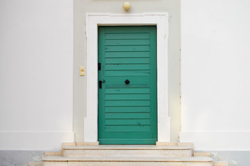 Green door on a church