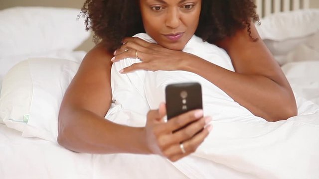 Woman photo messaging with smartphone