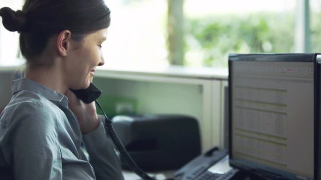Officer worker receiving and transferring telephone call