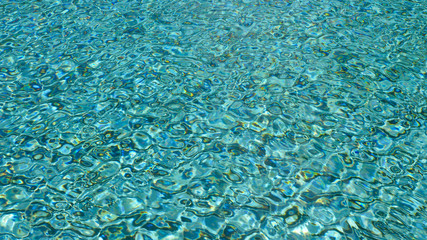 water ripple pattern in pool on sunny day