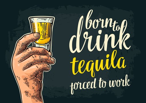 Male hand holding glass rum. Born to drink