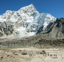 Tourists in the campaign against the backdrop of mount Everest (8848 m) and Nuptse from slope of...