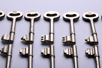 old vintage keys on a gray background