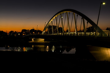 Main Street Tied Arch Suspension Bridge over Scioto River in Downtown Columbus, Ohio at Sunset