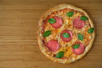 pizza with pepperoni and basil