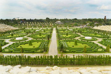 Panoramic view to local park with beautiful bushes and pathes for tourists at summer sunny day