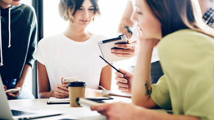 Group of young freelancers are thinking on the new marketing strategy for the new start up project....