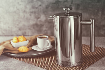 Coffee maker with cookies and fresh drink on napkin