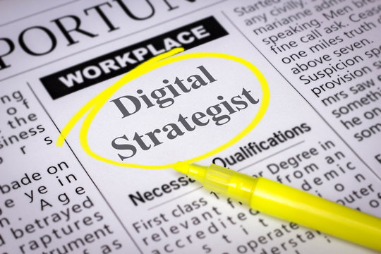 Digital Strategist - Newspaper sheet with ads and job search, circled with yellow marker, Blurred image and selective focus