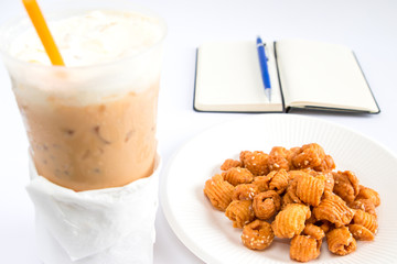 caramelized crisps with coffee and book