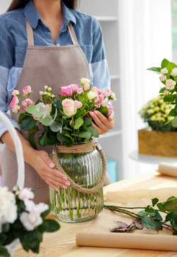 Young florist at workplace, close up view