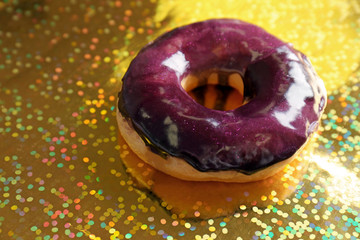 Glazed donut on colorful background
