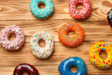 Glazed donuts on wooden background