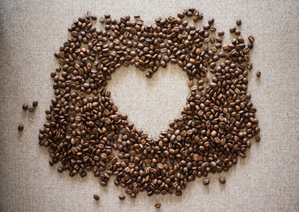 A Heart Shape Made Of Coffee Beans On The Textile Background