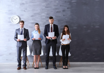 Group of young people waiting for interview indoors