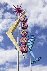 Old Vegas street sign over blue sky