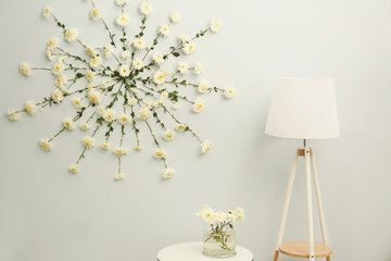 Modern room decorated with flower garland