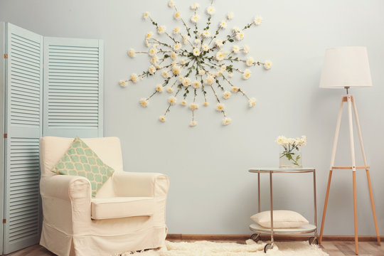 Modern room decorated with flower garland