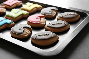 Obraz na płótnie Canvas Football cookies on baking tray, closeup