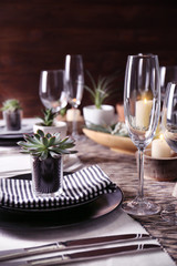 Table served with succulents for dinner in living room