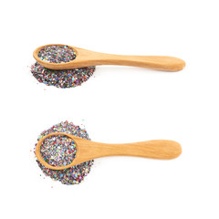 Wooden spoon full of sequins