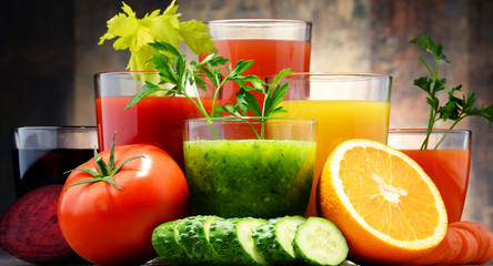 Glasses with fresh organic vegetable and fruit juices