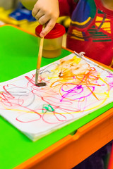 Small boy paint on the paper