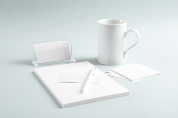 Blank office supplies on grey background