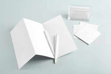 Blank office supplies on grey background