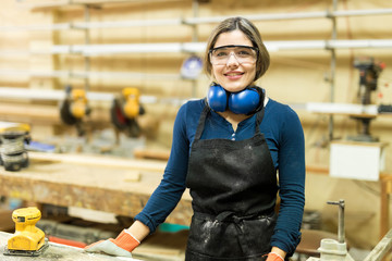 Portrait of a young female carpenter