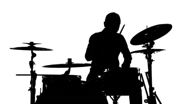 Silhouette of the drummer and drums