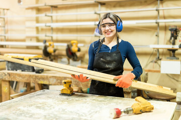 Female carpenter enjoying her work