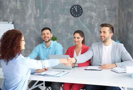 Job interview concept. Human resources commission interviewing woman