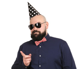 Bearded fat man with party hat on white background