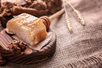 Fresh honeycomb on wooden board