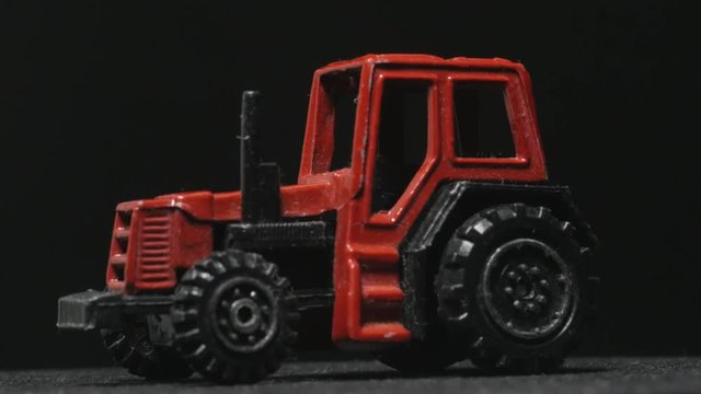 Farmer's tractor toy rotating.