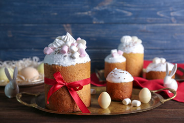 Tasty Easter cakes with decorations on table