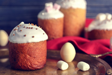 Tasty Easter cake with decorations on tray