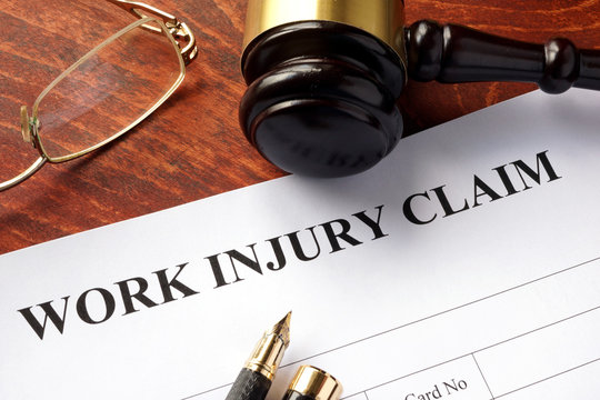 Worker compensation. Work injury claim on a table. 
