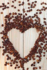  Coffee beans on the board in the form of heart