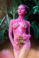 Woman in paint. Attractive and sexy girl body art
