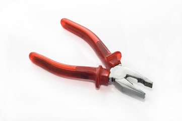 Red pliers isolated on white background, work tools concept
