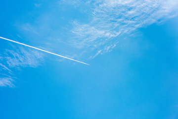 Contrails against the blue sky, Pattern of clouds in the blue sky, blue sky with cloud.