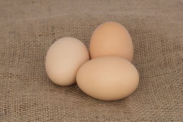 Eggs on burlap background