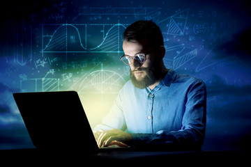 Businessman in the office at night