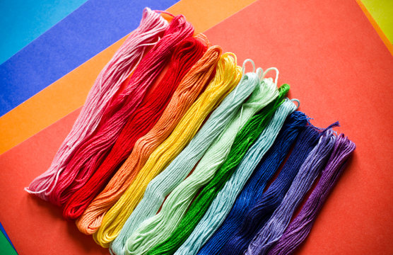 Embroidery floss on a colored background
