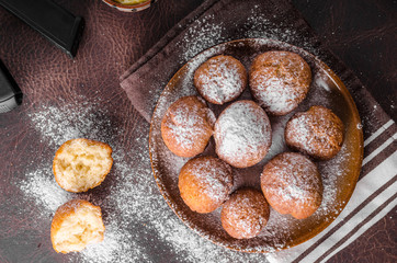 Homemade donuts with sugar and gun