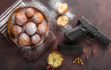 Homemade donuts with sugar and gun